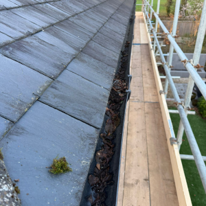 Scaffolding platform across a roof